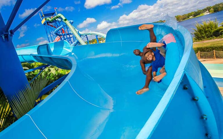 young boys sliding on tube water slide at legoland florida water park winter haven