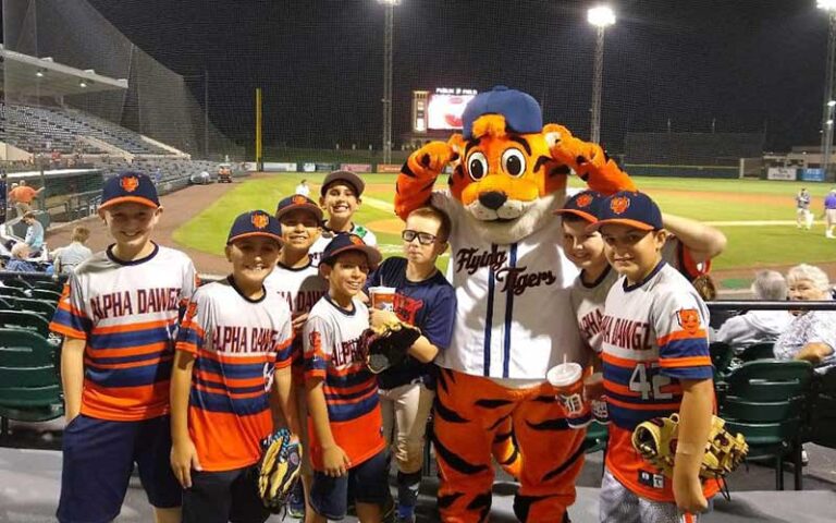 young players with tiger mascot at baseball field at publix field at joker marchant stadium lakeland