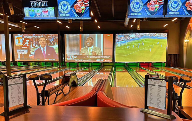 bowling lanes with sports on screens at fun depot lake worth west palm beach