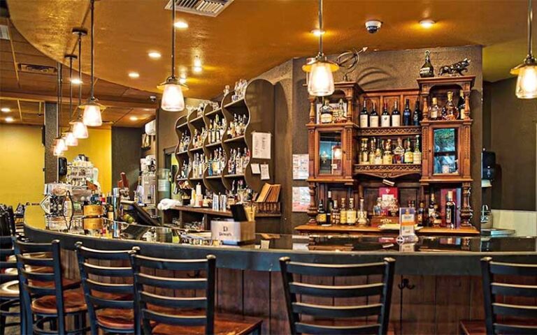 curved bar area with rustic decor at frescos southern kitchen bar lakeland