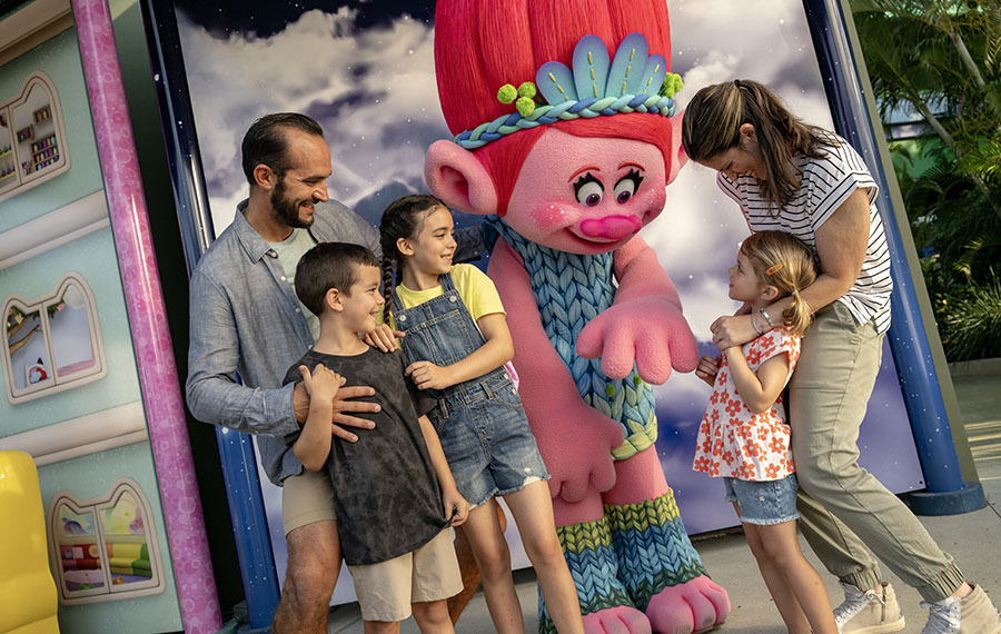 costumed poppy troll character interacting with family at dreamworks land universal studios florida