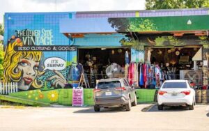 front exterior of store with rollup doors and mural at the other side vintage tallahassee
