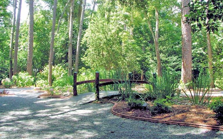 garden area with arching bridge at dorothy b oven park tallahassee