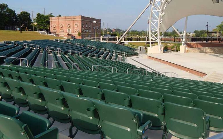 green seats in amphitheater with canopy and building at cascades park tallahassee