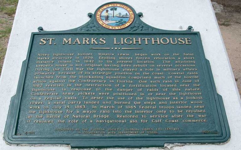 historic plaque marker on building with description at st marks lighthouse