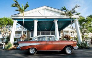 hotel front exterior with red classic car at havana cabana key west
