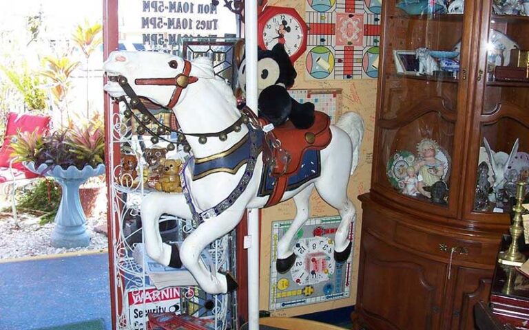 interior of store with carousel horse and shelves at shermans antiques winter haven