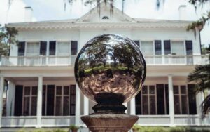 mirrored ball with stately home behind at goodwood museum gardens tallahassee