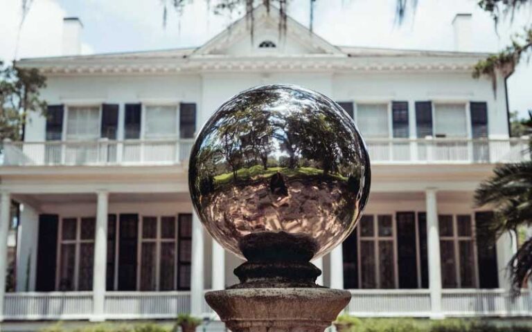 mirrored ball with stately home behind at goodwood museum gardens tallahassee