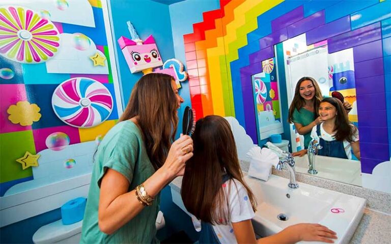 mom and girl in lego bathroom with unikitty at legoland hotel winter haven