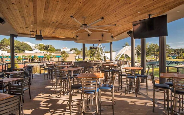 outdoor dining deck with park view at the edison tallahassee