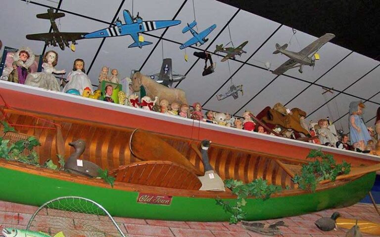 overhead display shelf with canoe and toys at shermans antiques winter haven