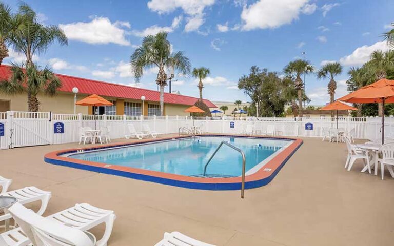 pool deck with loungers at howard johnson by wyndham lakeland