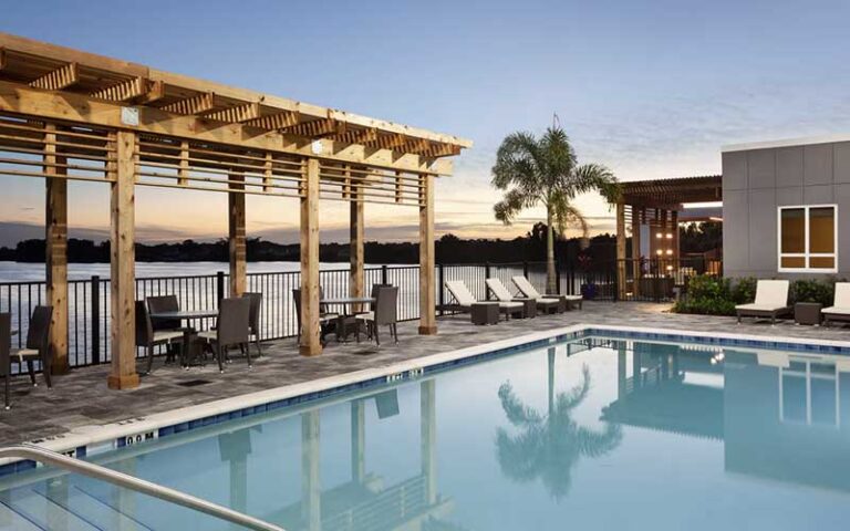pool deck with pergola and seating at courtyard winter haven