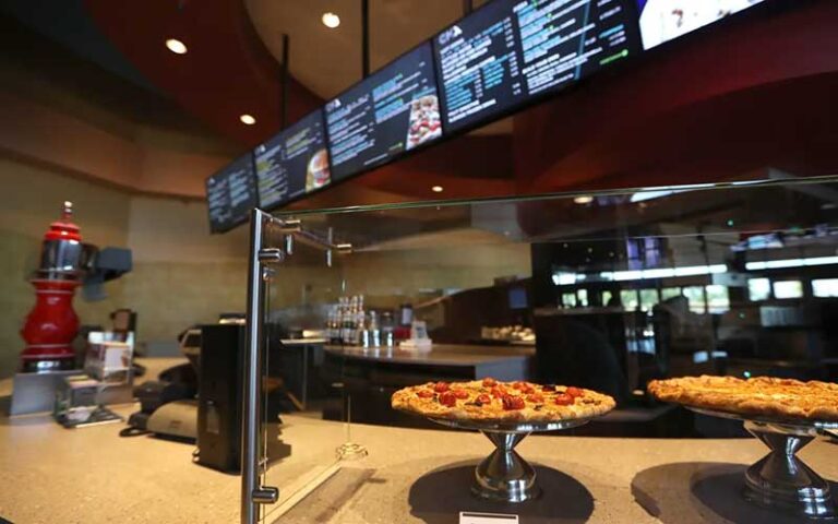 restaurant counter with menus and pizzas at cmx cinemas fallschase tallahassee