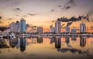 skyline from bay of marina boats and buildings with dusk sky reflected st pete