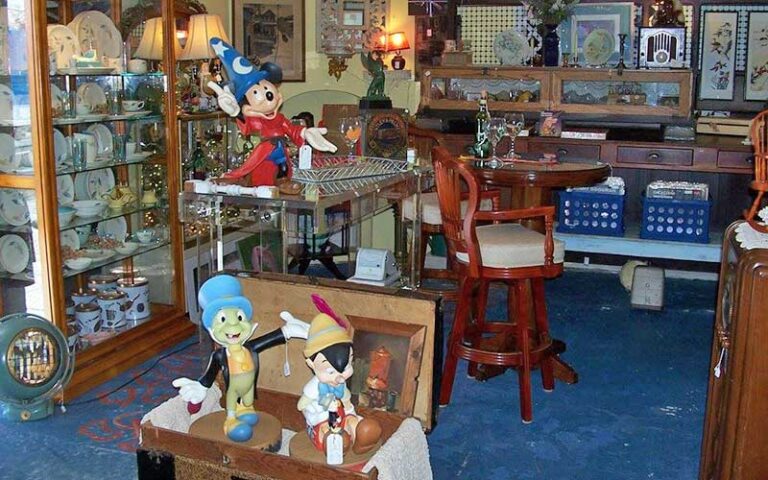 store area with disney statues and wood furniture at shermans antiques winter haven