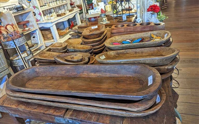 wooden carved trays on table with shelves of diy crafts at rabbit creek market tallahassee