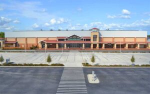aerial of front exterior with parking and clear sky at silver spurs arena kissimmee