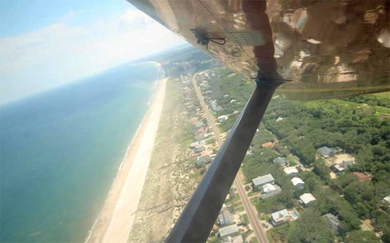 aerial view of coastline from skid of aircraft at skydiving jacksonville amelia island