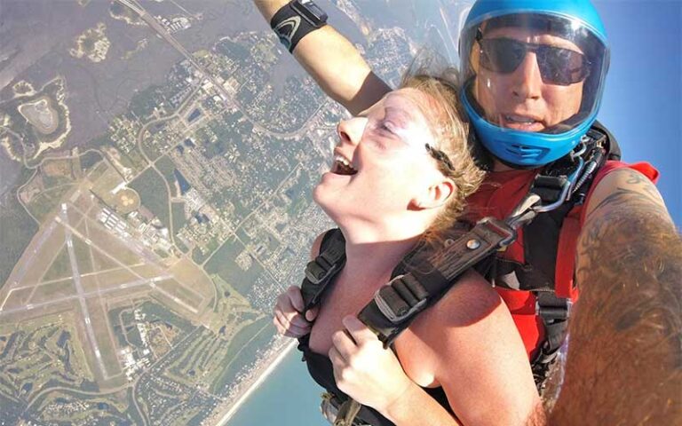 aerial view of tandem skydivers with landscape below at skydiving jacksonville amelia island