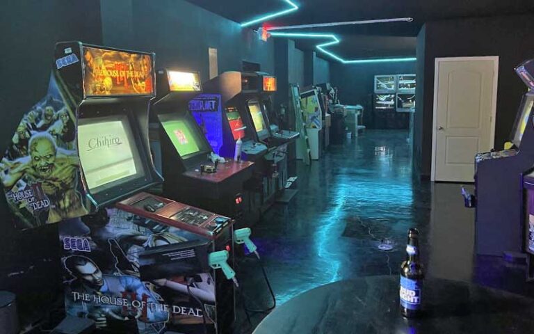 arcade area with games and neon light effects at the grid arcade pensacola