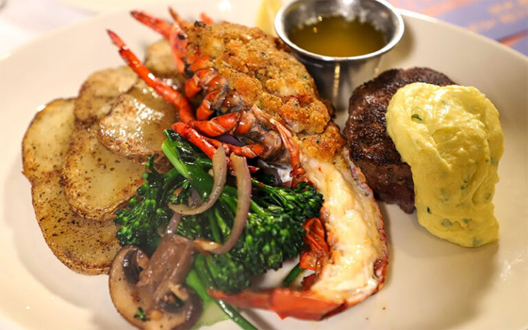 baked lobster with steak egg and sides at columbia restaurant celebration kissimmee