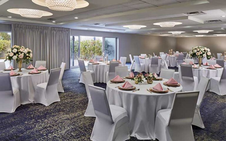 ballroom event space with draped tables and flowers at four points by sheraton tallahassee downtown