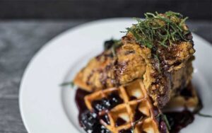 blackberry chicken and waffles dish at table 23 tallahassee