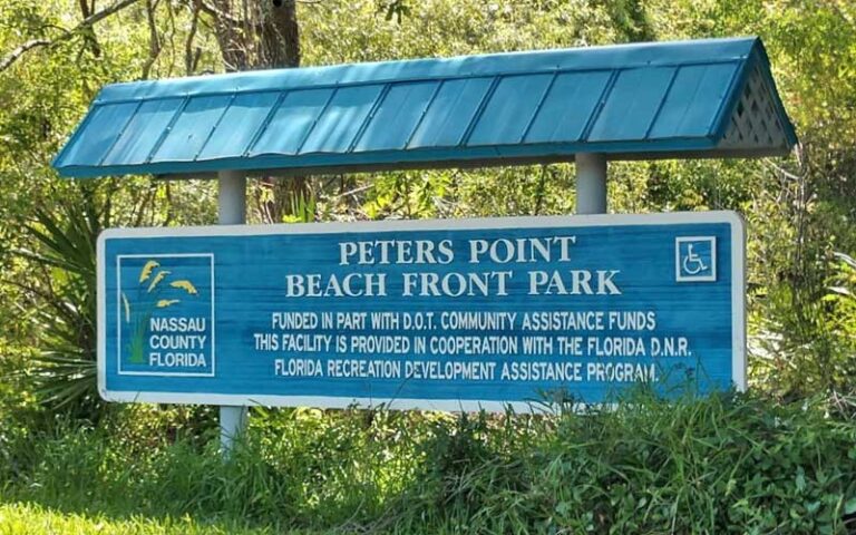 blue park sign with metal eave at peters point beachfront park amelia island