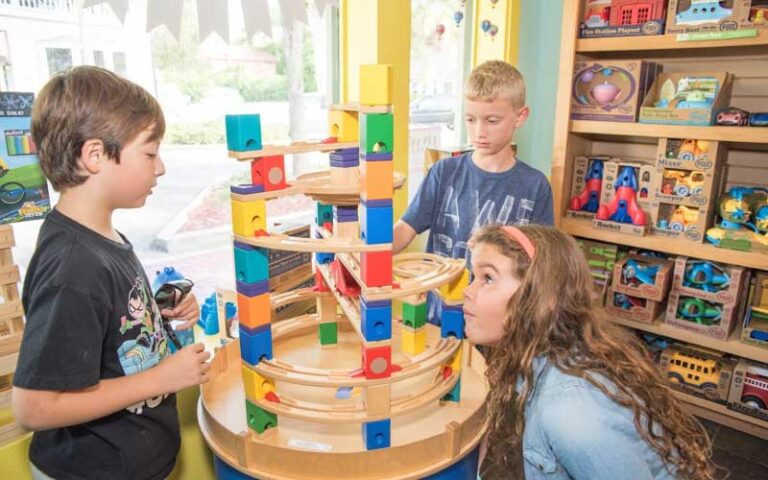 boys and girls playing with wooden block set at villa villekulla neighborhood toy store fernandina beach amelia island