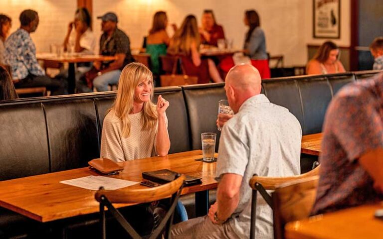 couple having drinks in dining area at liberty bar restaurant tallahassee