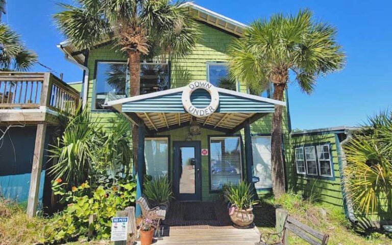 daytime exterior of green building with entrance at down under restaurant fernandina beach amelia island