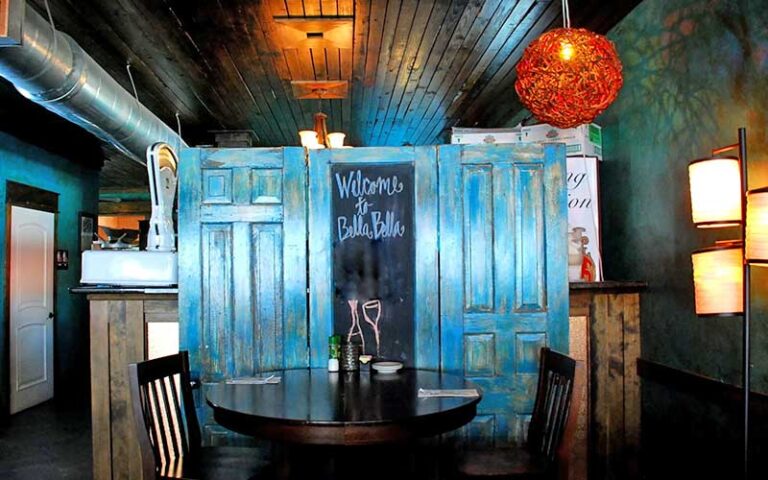 diner interior with tables and low lighting at bella bella tallahassee