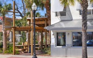 exterior of restaurant with outdoor seating and sign at timotis seafood shak fernandina beach amelia island