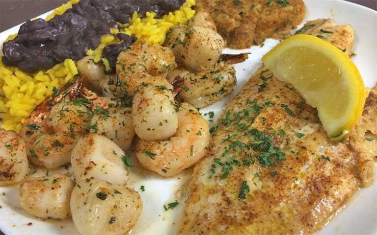 fish filet scallops yellow rice and black beans platter at crabby bills st cloud kissimmee