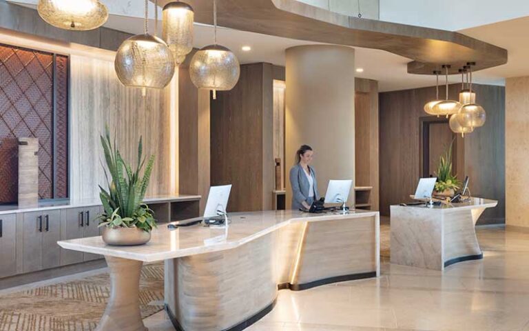 front desk in hotel lobby with lighting globes at jw marriott orlando bonnet creek resort spa