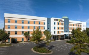 front exterior of multi story hotel with parking at home2 suites by hilton tallahassee state capital