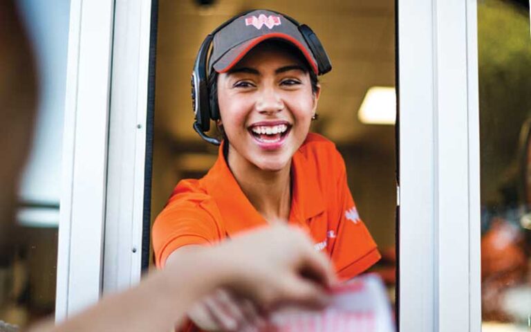 girl serving drive thru window at whataburger west pensacola