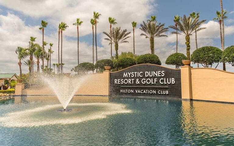 hotel sign with pool palms and fountain at hilton vacation club mystic dunes orlando celebration