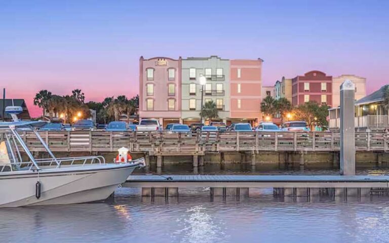 hotel viewed from water with dock and boat at hampton inn suites amelia island historic harbor front fernandina beach