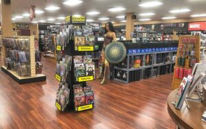 interior of store with comic book racks and wonder woman statue at coliseum of comics kissimmee