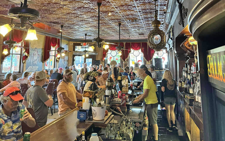 interior of crowded bar with period decor at palace saloon fernandina beach amelia island