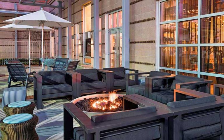 lighted patio terrace with fire pit and seating at aloft downtown tallahassee