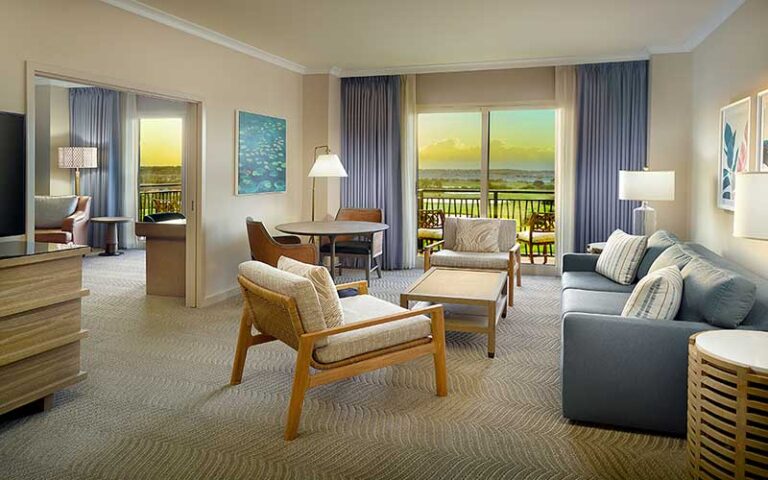 living area suite with golf course view at omni orlando resort at championsgate