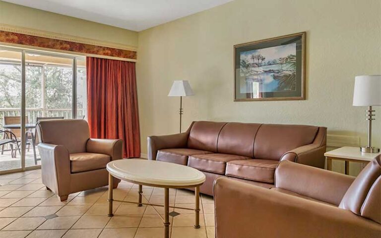 living room area with patio suite at hilton vacation club mystic dunes orlando celebration