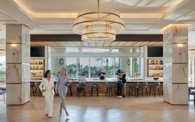 lobby with marble columns and bar at signia by hilton orlando bonnet creek