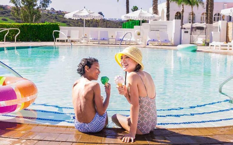 mom and kid on edge of pool at the villas of amelia island fernandina beach