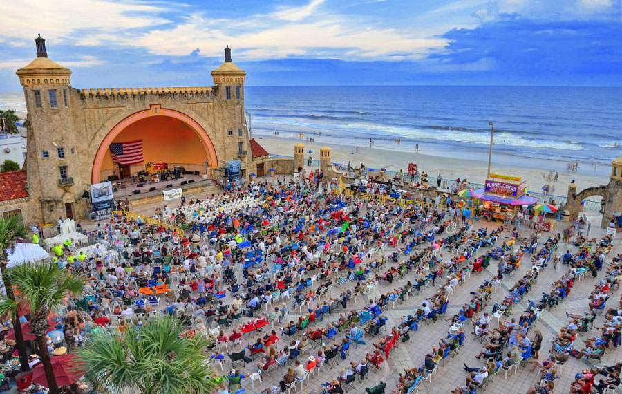 ocean front stage concert with crowd at daytona beach bandshell