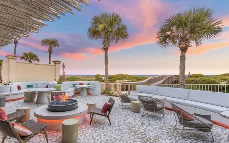 outdoor patio with fire pit at dusk at the ritz carlton amelia island